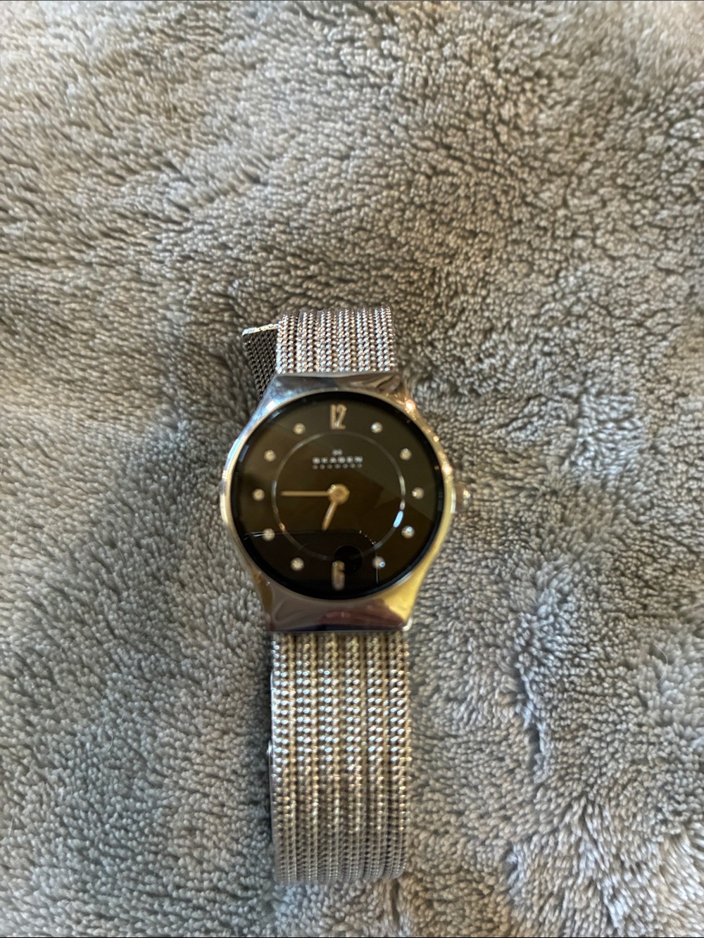 Skagen Silver Mesh Watch with Black Dial and Crystal Markers.